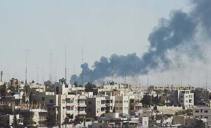 Smoke rises over the Jordanian capital after clashes between the Jordanian military and the PLO.