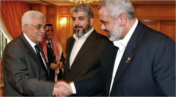 Abbas and Haniyeh shake hands at Mecca. Credit: Reuters